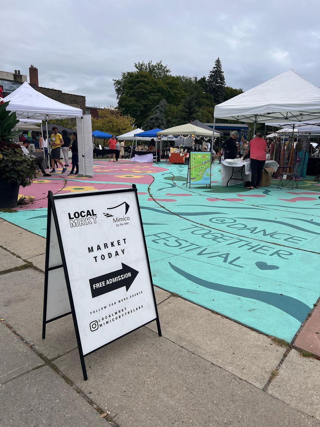 LOCALMRKT runs pop up markets in Mimico Bloor area. This image shows last years event with vendors under their canopies.