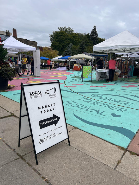 LOCALMRKT runs pop up markets in Mimico Bloor area. This image shows last years event with vendors under their canopies.